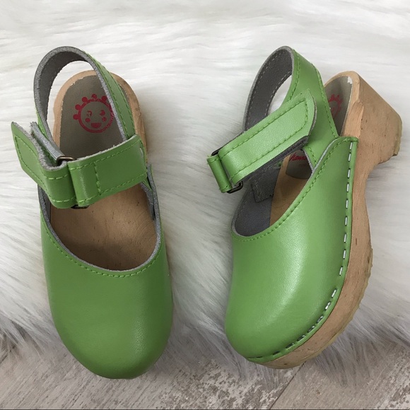 green wooden clogs